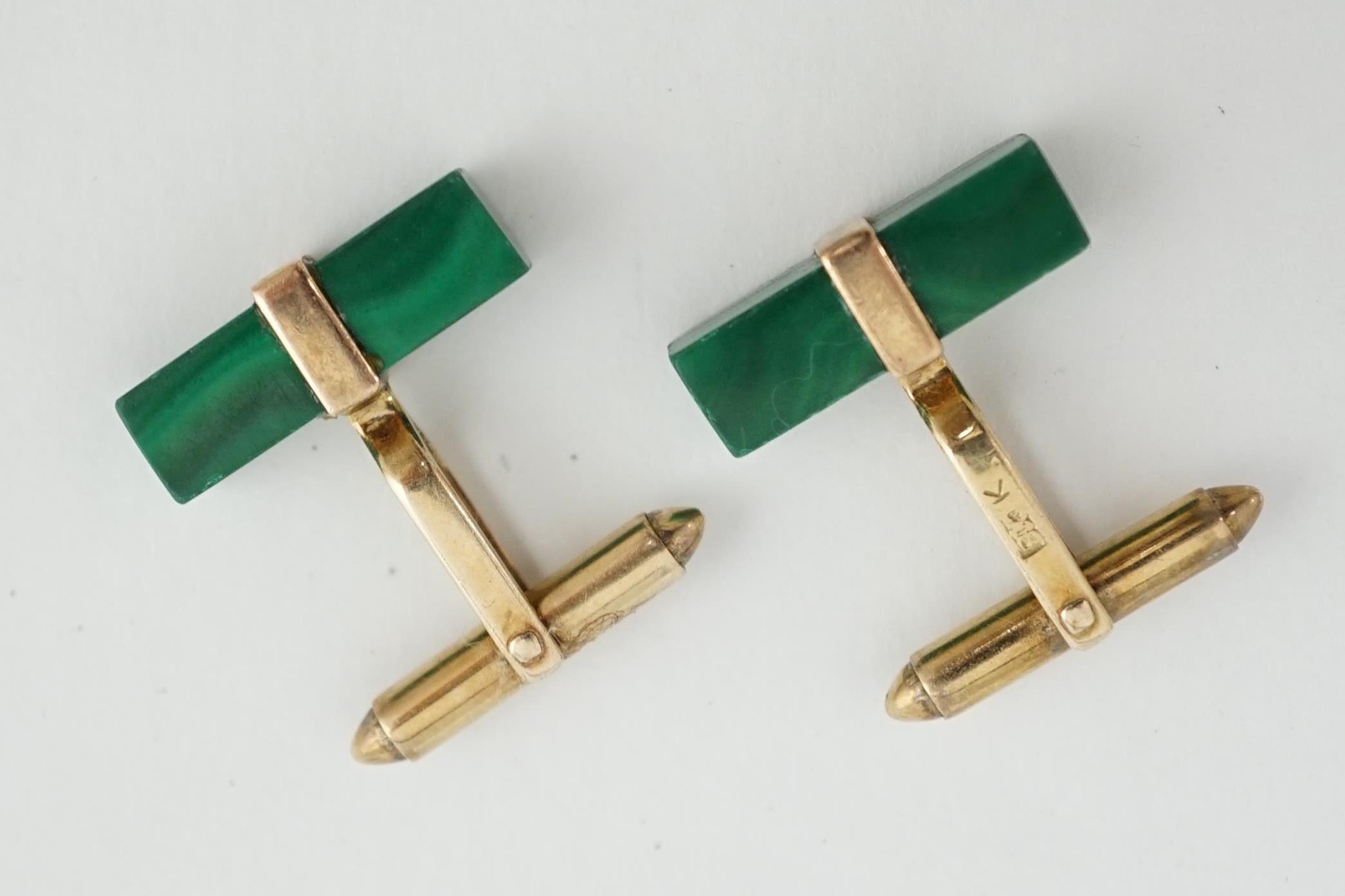 A pair of Chinese 9k gold and malachite set cufflinks